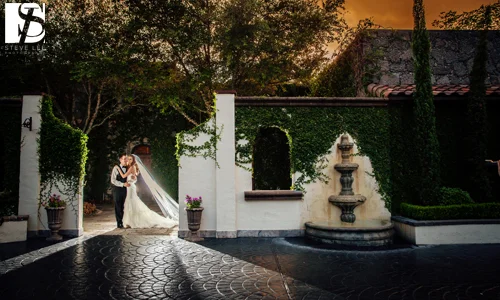 Couple by the Courtyard Fountain at Dusk, The Bell Tower on 34th