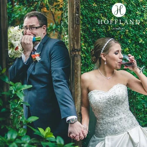 Candid pre-ceremony moment as bride and groom share nerves and laughs at The Bell Tower on 34th’s garden wall.